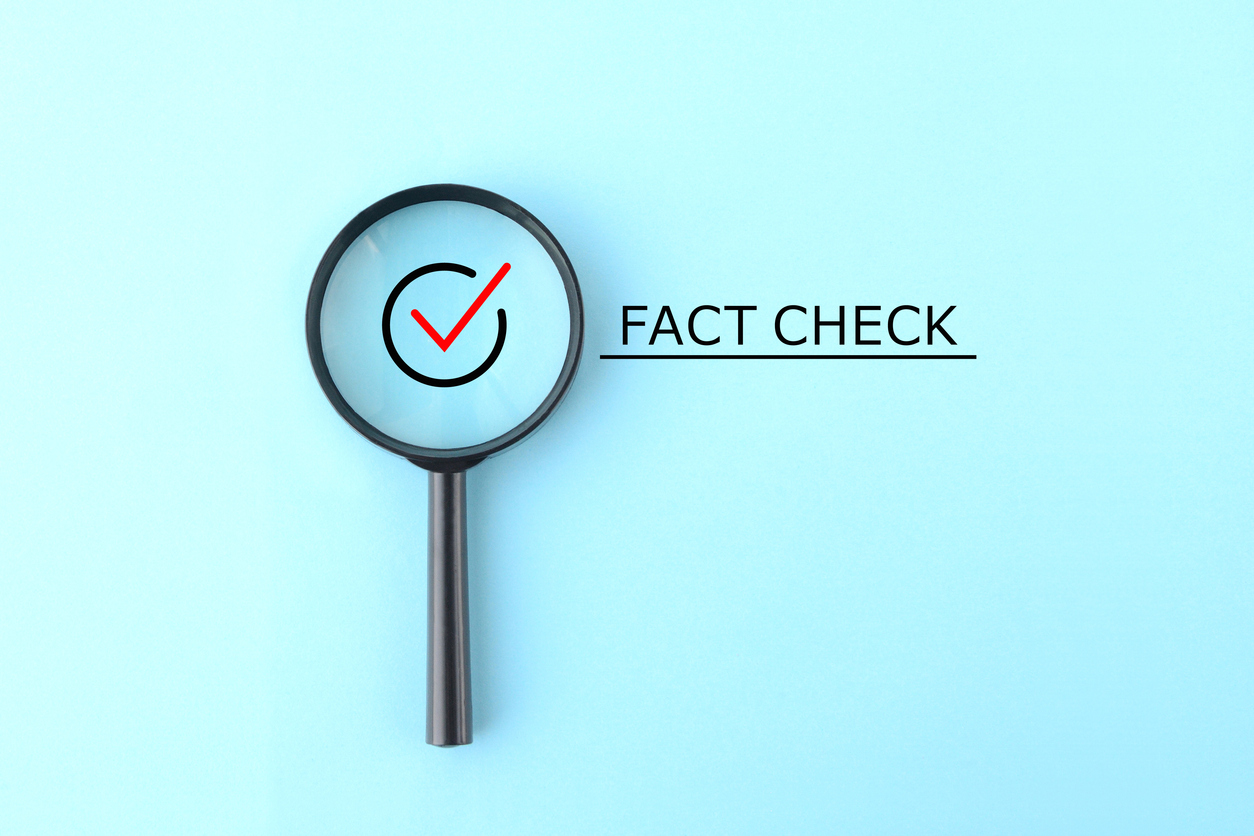 magnifying glass and verbiage that reads fact check