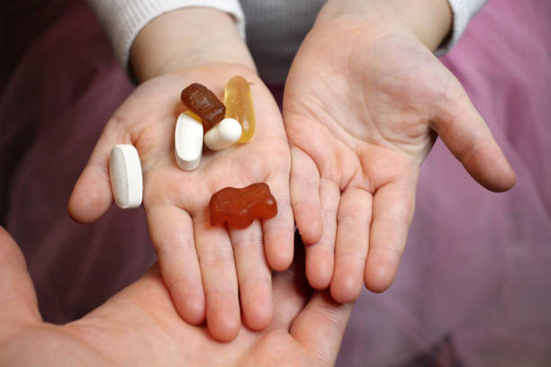 Hand holding supplements.