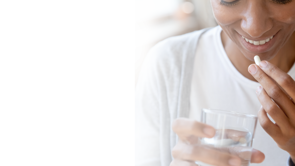 Healthy woman taking a supplement